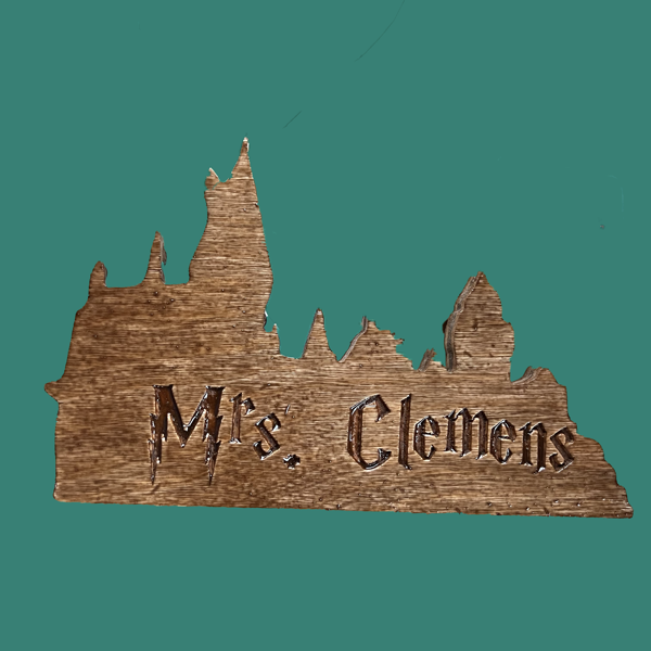 Silhouette of Hogwarts with engraved name in Harry Potter Font