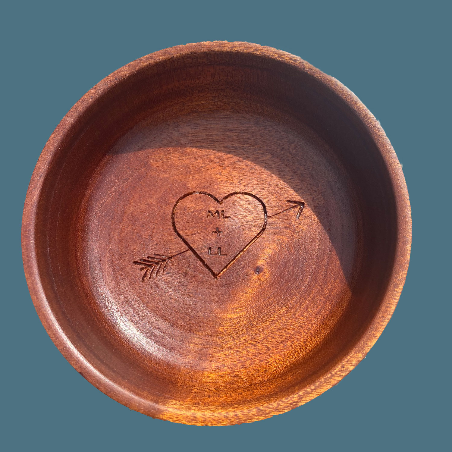 Wooden bowl with engraved arrow and heart with initials