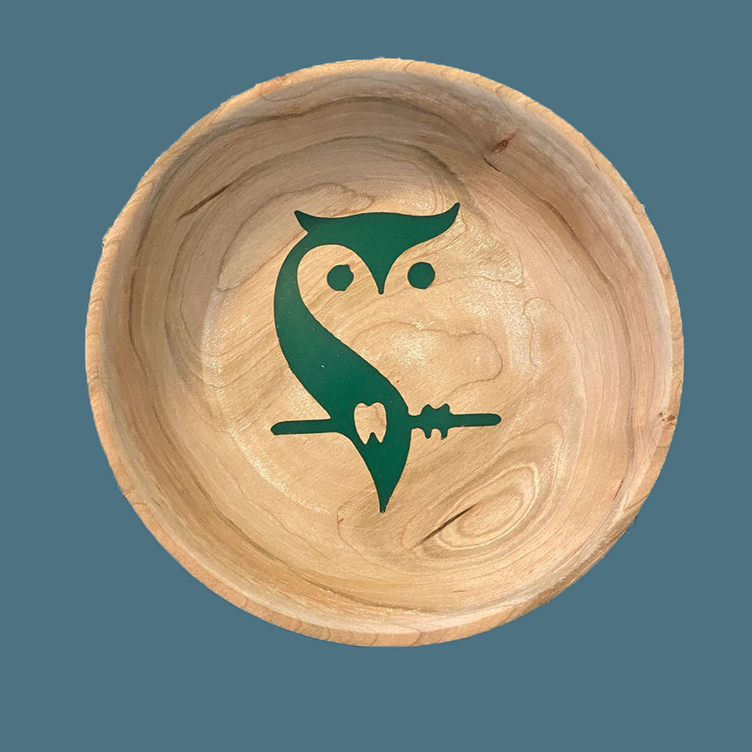 Wooden bowl with carved design filled with epoxy